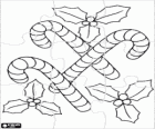 Rompicapo di Decorazioni di Natale. Puzzle di bastoncini di zucchero con qualche rametto di agrifoglio